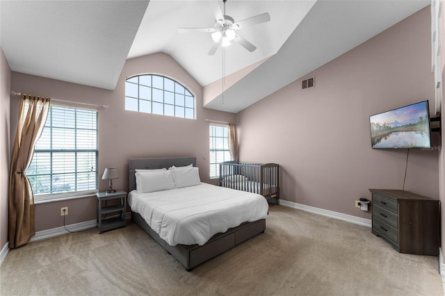 bedroom featuring ceiling fan, light carpet, and lofted ceiling