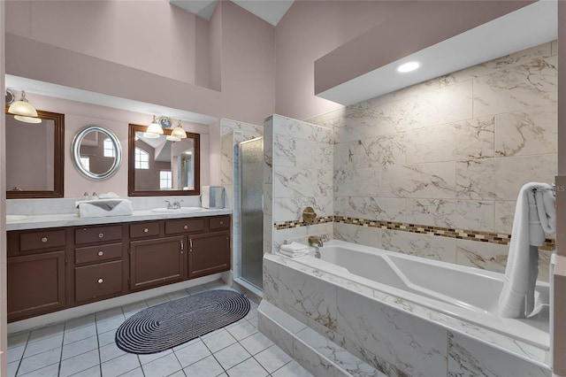 bathroom with vanity, tile patterned flooring, and plus walk in shower