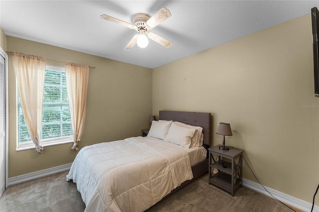 carpeted bedroom with ceiling fan