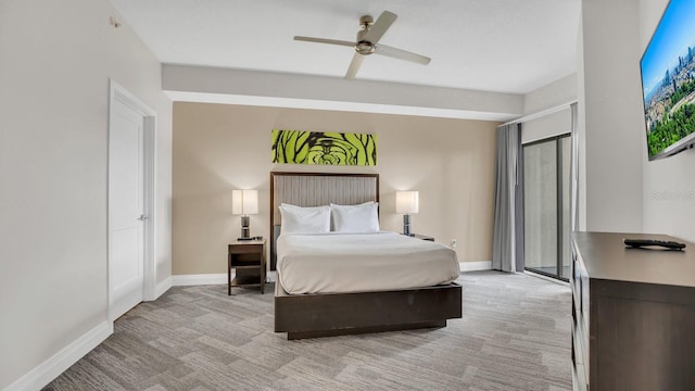 bedroom with ceiling fan and light colored carpet