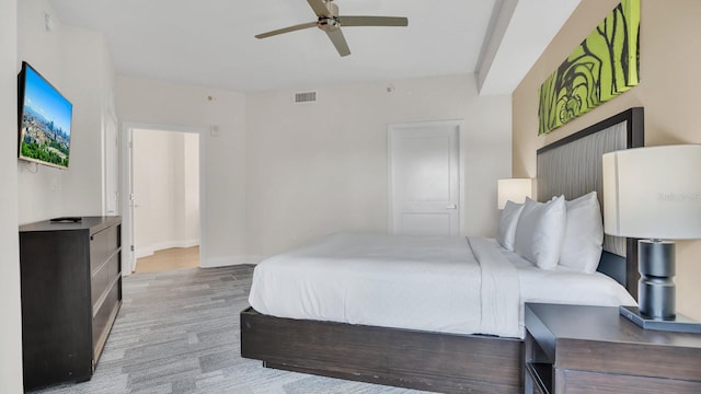 bedroom with ceiling fan and light wood-type flooring