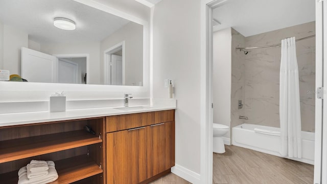 full bathroom with wood-type flooring, vanity, toilet, and shower / bath combination with curtain