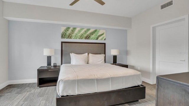 bedroom with light wood-type flooring and ceiling fan