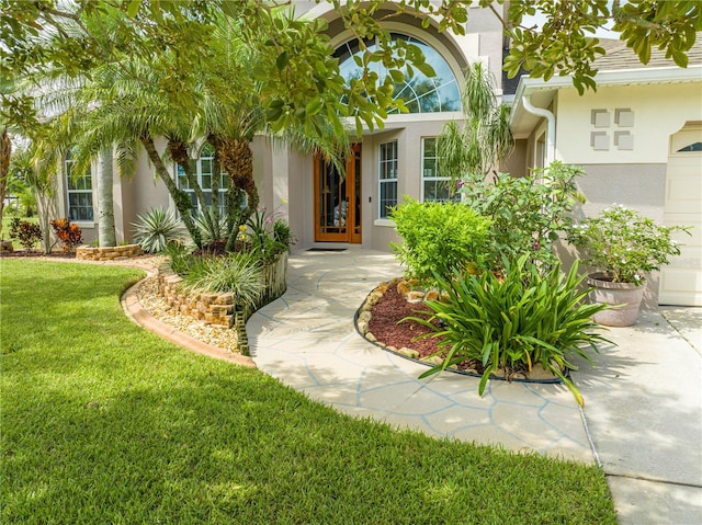 entrance to property with a yard