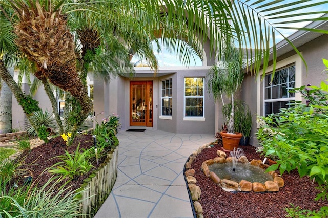 property entrance with a patio