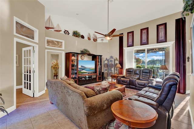 tiled living room featuring high vaulted ceiling and ceiling fan