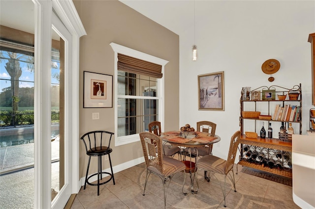 dining area featuring light tile patterned floors