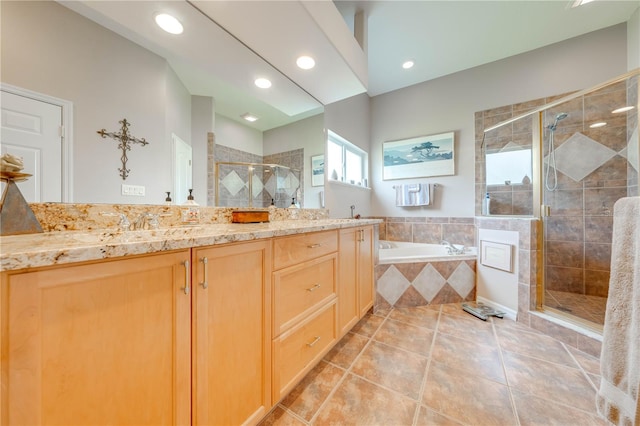 bathroom featuring separate shower and tub, tile patterned flooring, and vanity