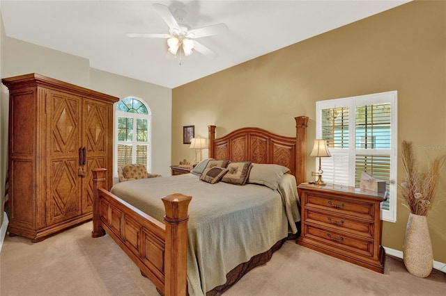 bedroom with light colored carpet and ceiling fan