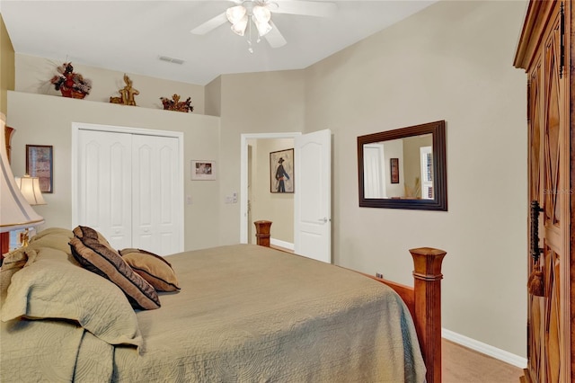 carpeted bedroom featuring a closet and ceiling fan