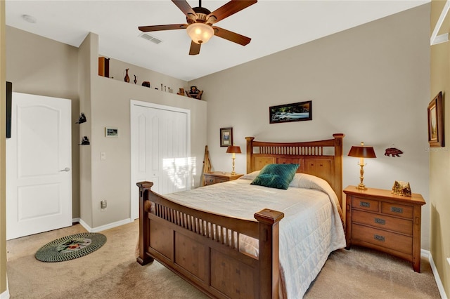 bedroom with ceiling fan and light colored carpet