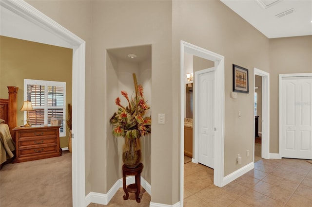 hallway with light tile patterned floors