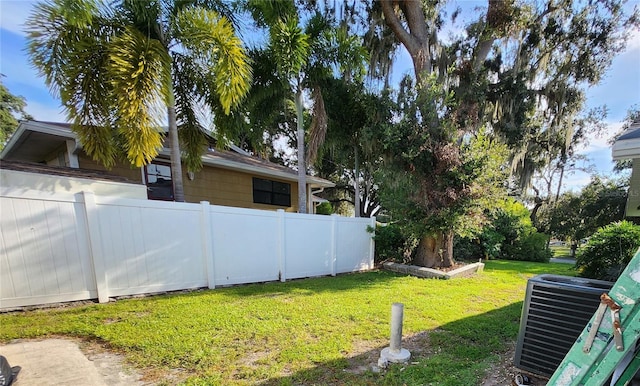 view of yard with central AC unit