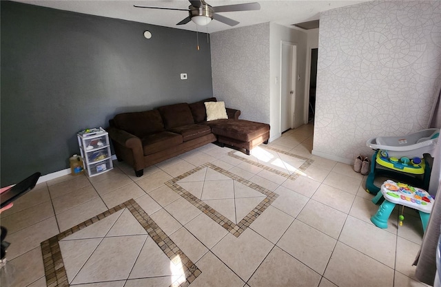 living room featuring ceiling fan and light tile patterned floors