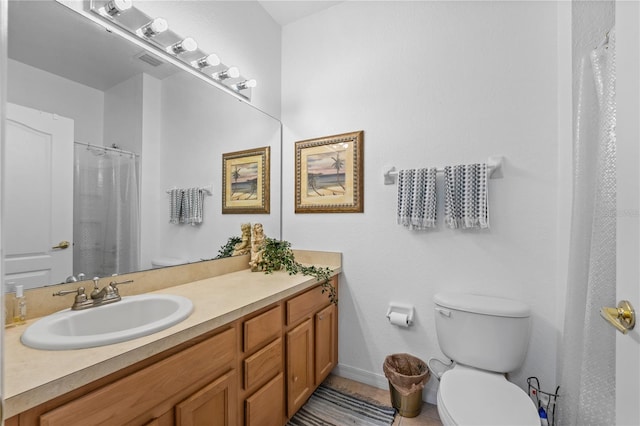 bathroom featuring a shower with shower curtain, tile patterned floors, vanity, and toilet