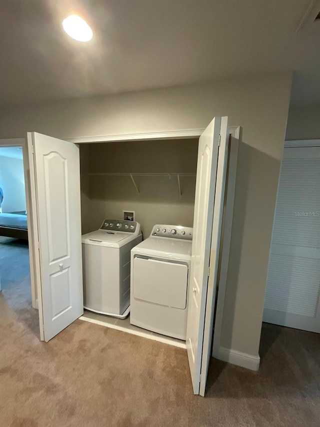 226 Macaulays Cv, Haines City, FL 33844 - laundry room with carpet and washer and dryer