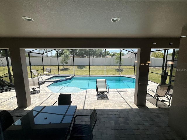 view of swimming pool with a lawn, a patio, and glass enclosure