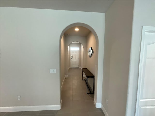 hallway with light tile patterned floors