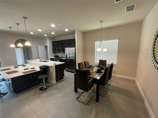 226 Macaulays Cv, Haines City, FL 33844 - dining room featuring light tile patterned floors, recessed lighting, and a chandelier