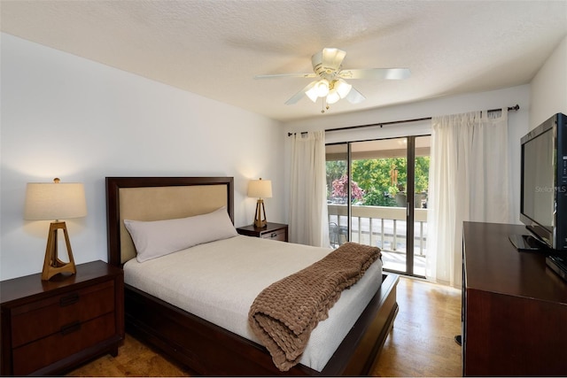 bedroom with ceiling fan, hardwood / wood-style flooring, access to exterior, and a textured ceiling