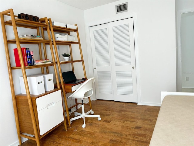 office with dark wood-type flooring