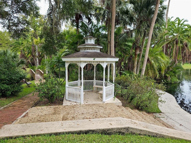 exterior space featuring a gazebo and a water view