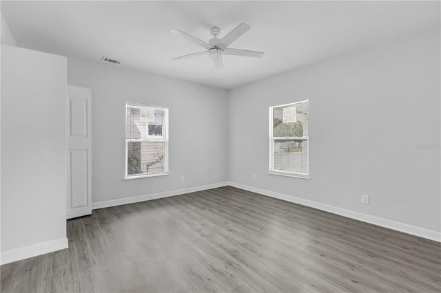 unfurnished room with hardwood / wood-style floors and ceiling fan