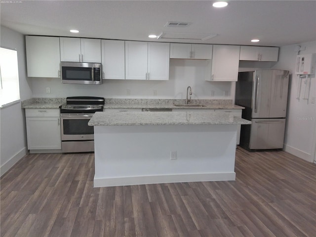 kitchen featuring white cabinetry, stainless steel appliances, sink, and dark hardwood / wood-style floors