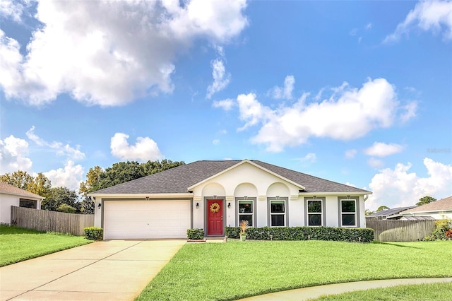 ranch-style home with a garage and a front yard