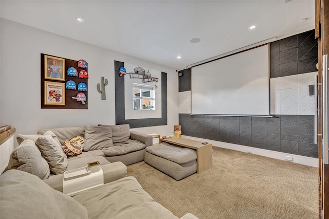 cinema room featuring light carpet