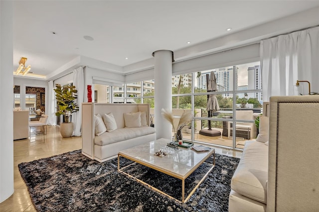 living room with a wealth of natural light and light tile patterned flooring