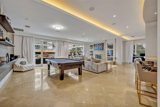 recreation room with billiards and plenty of natural light