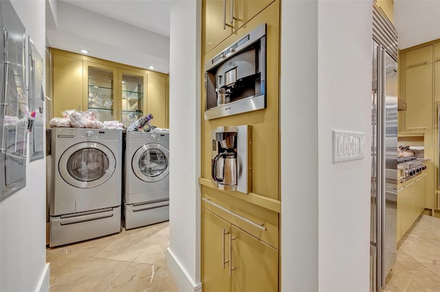 clothes washing area featuring washer and clothes dryer