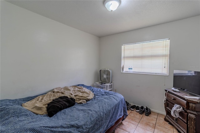 bedroom with light tile patterned flooring