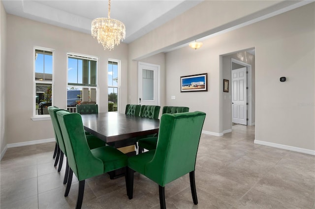 tiled dining area with an inviting chandelier