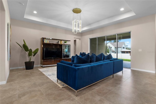 living room with a raised ceiling