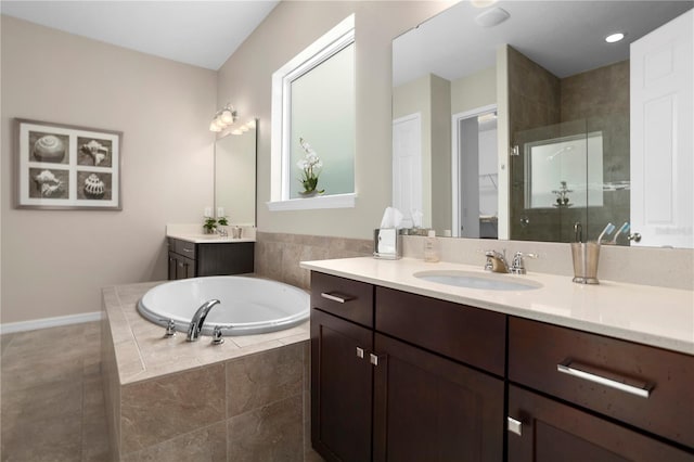 bathroom with vanity, shower with separate bathtub, and tile patterned floors