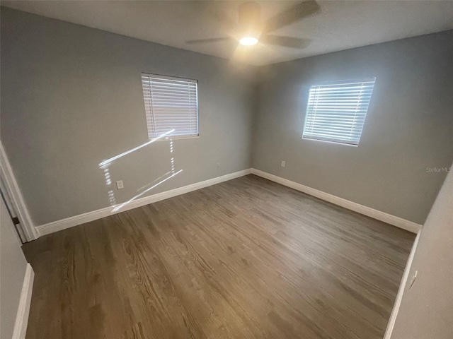 spare room featuring ceiling fan and wood-type flooring