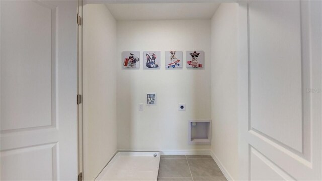 laundry area with washer hookup, light tile patterned flooring, and hookup for an electric dryer