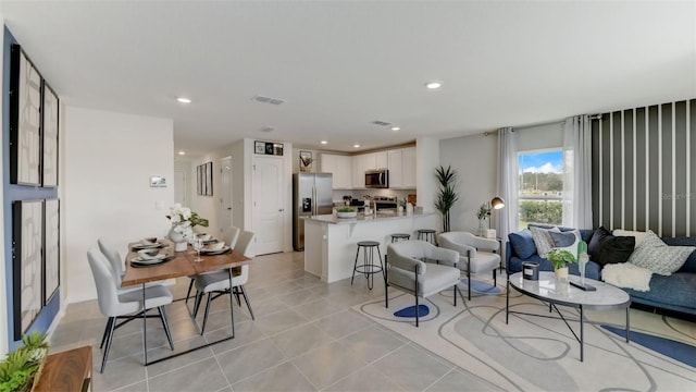 living room featuring light tile patterned floors