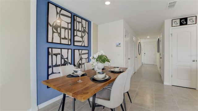 dining area with light tile patterned flooring