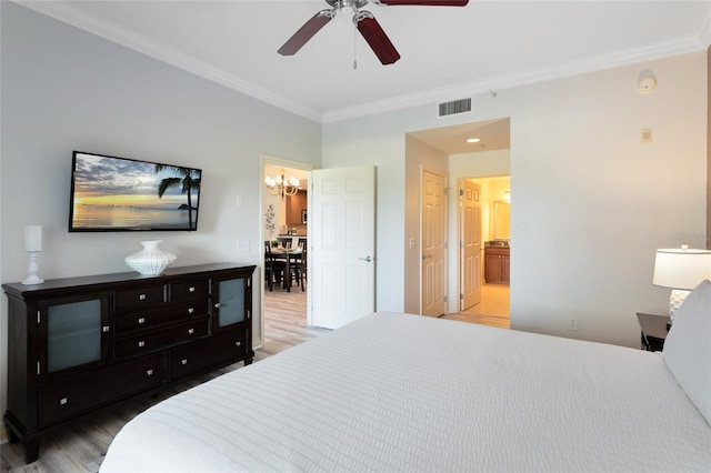 bedroom featuring ornamental molding, connected bathroom, ceiling fan, and wood-type flooring