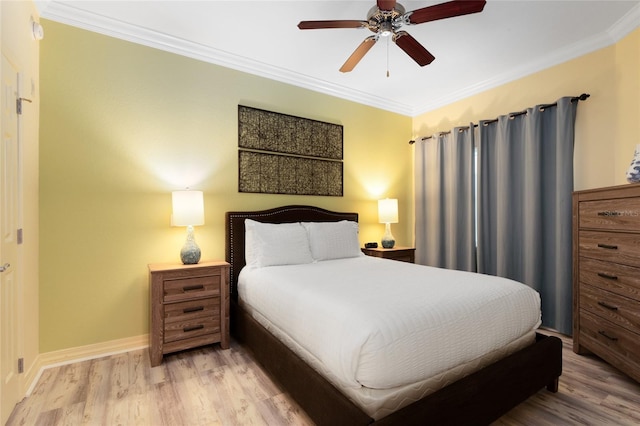 bedroom with light wood-type flooring, crown molding, and ceiling fan