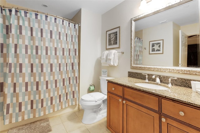 bathroom featuring tile patterned flooring, vanity, and toilet