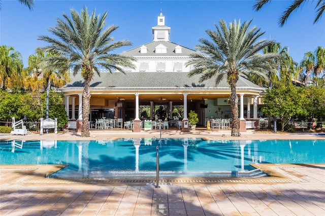 view of pool featuring a patio and ceiling fan