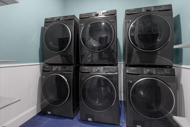 1021 Fantasy Dr, Davenport, FL 33896 - washroom with stacked washer and clothes dryer and wainscoting