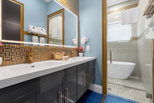 1021 Fantasy Dr, Davenport, FL 33896 - bathroom with double vanity, decorative backsplash, a freestanding bath, a shower stall, and tile patterned floors