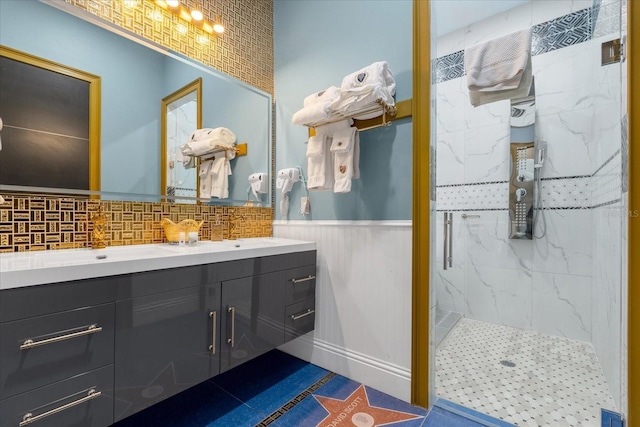 1021 Fantasy Dr, Davenport, FL 33896 - bathroom featuring vanity, a marble finish shower, backsplash, and wainscoting