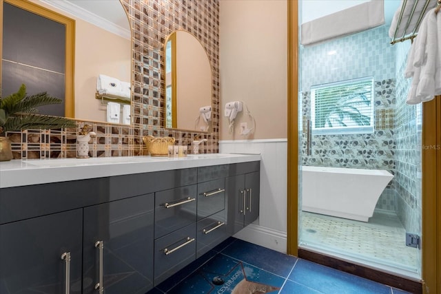 1021 Fantasy Dr, Davenport, FL 33896 - full bath featuring double vanity, tile patterned flooring, a soaking tub, ornamental molding, and a wainscoted wall