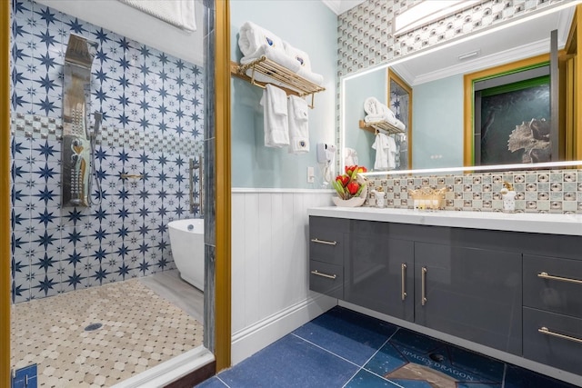 1021 Fantasy Dr, Davenport, FL 33896 - bathroom with tile patterned floors, vanity, a wainscoted wall, and a soaking tub